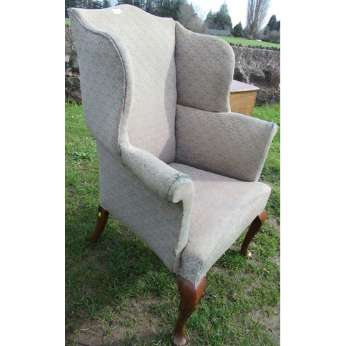 53 - A Georgian design wing back chair