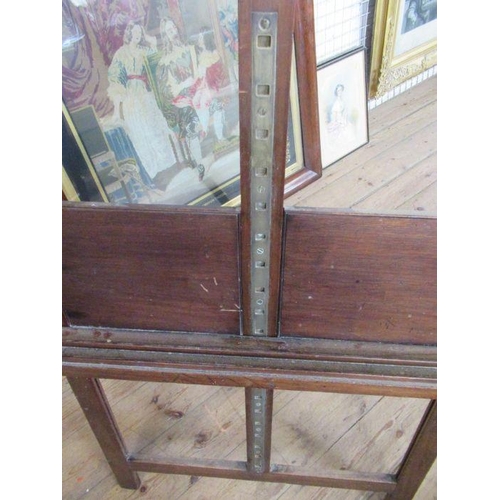 11 - An adjustable oak artists easel, stamped Halford Bros. Oxford St, London, height 72ins, width 29ins