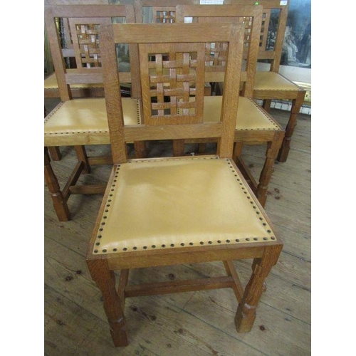 13 - A Robert 'Mouseman' Thompson of Kilburn set of six oak lattice back dining chairs,