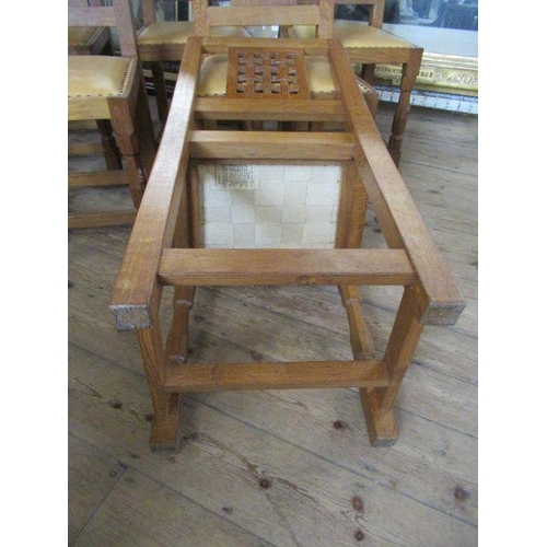 13 - A Robert 'Mouseman' Thompson of Kilburn set of six oak lattice back dining chairs,