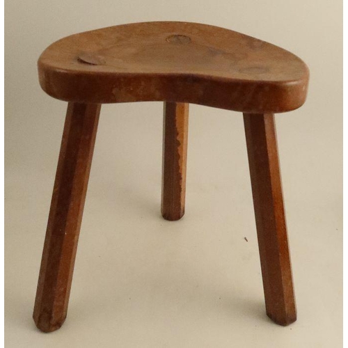 16 - A Robert Mouseman Thompson three legged stool, with shaped seat and chamfered legs, height 14ins