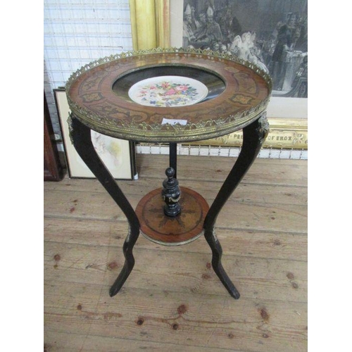 17 - A 19th century walnut and ebonized table, with gilt metal mounts and floral inlay top, set with a po... 