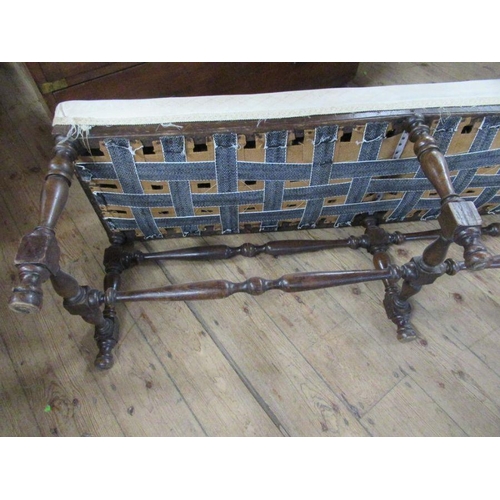 20 - An oak framed long stool, raised on six turned legs, united by stretchers, width 58ins, depth 17ins,... 