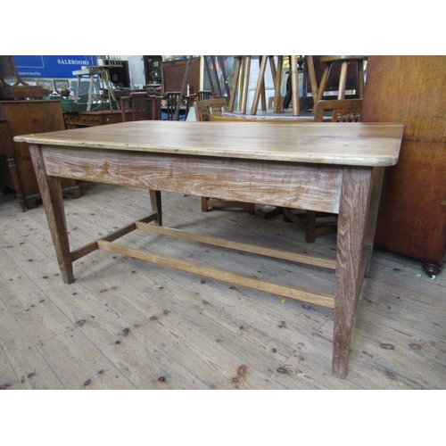 31 - A pine rectangular kitchen table, raised on four square tapering legs, united by a stretcher, 60ins ... 