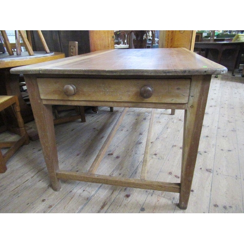 31 - A pine rectangular kitchen table, raised on four square tapering legs, united by a stretcher, 60ins ... 