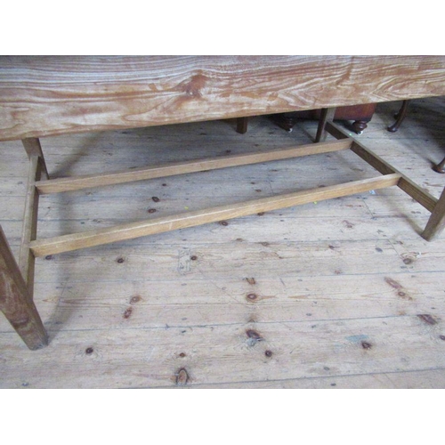 31 - A pine rectangular kitchen table, raised on four square tapering legs, united by a stretcher, 60ins ... 