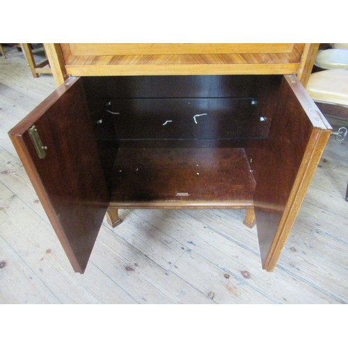 32 - A satinwood and marquetry inlaid cabinet, inlaid all round, fitted with one long drawer over a fall ... 