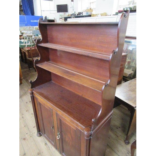 34 - A 19th century mahogany waterfall bookcase/ chiffonier, having waterfall set of shelves over cupboar... 