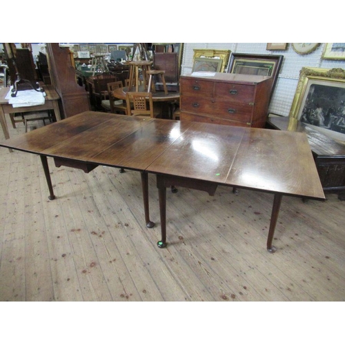 35 - A 19th century mahogany extending gate leg dining table, made up of two sections, raised on turned l... 