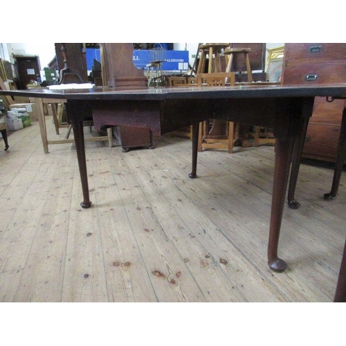 35 - A 19th century mahogany extending gate leg dining table, made up of two sections, raised on turned l... 