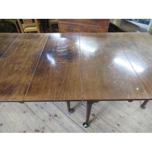 35 - A 19th century mahogany extending gate leg dining table, made up of two sections, raised on turned l... 