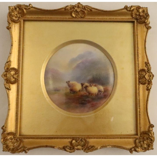 384 - A framed Royal Worcester circular plaque, painted with six sheep in a Highland setting by Harry Davi... 