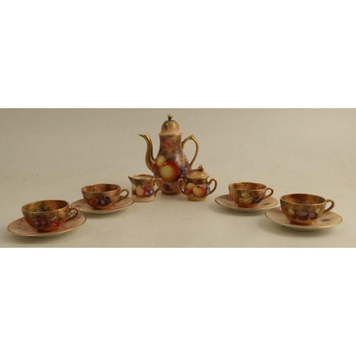 385 - A Royal Worcester miniature coffee set, consisting of coffee pot, sugar box and cover, milk jug and ... 