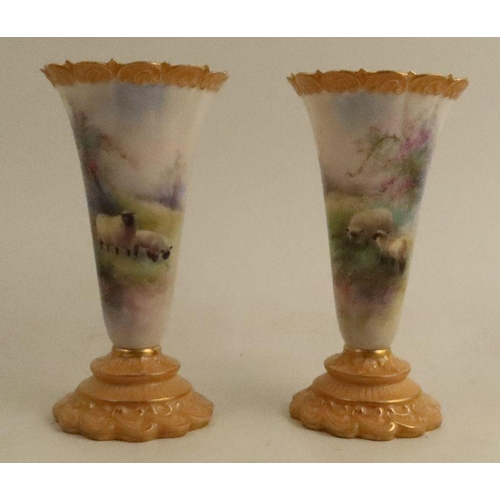 387 - A pair Royal Worcester vases, decorated with sheep in a spring meadow with blossom tree by Harry Dav... 