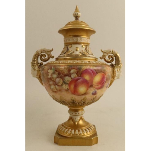 388 - A Royal Worcester covered pedestal vase, painted all round with fruit to a mossy ground by Freeman, ... 