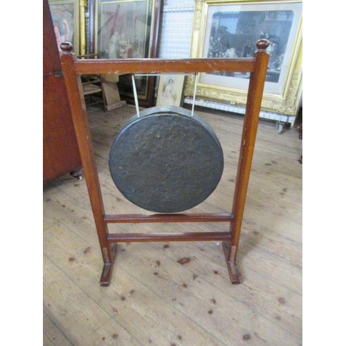 39 - A table gong, width 22ins, height 32ins