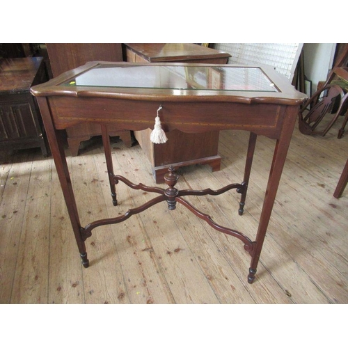 48 - An Edwardian mahogany and inlaid bijouterie table, with beveled plates to glass, with shaped lid, st... 