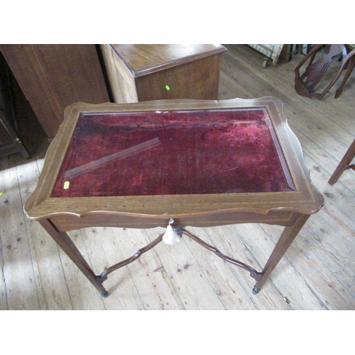 48 - An Edwardian mahogany and inlaid bijouterie table, with beveled plates to glass, with shaped lid, st... 