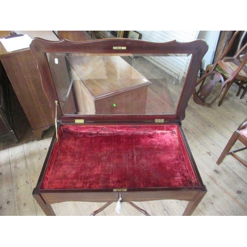 48 - An Edwardian mahogany and inlaid bijouterie table, with beveled plates to glass, with shaped lid, st... 