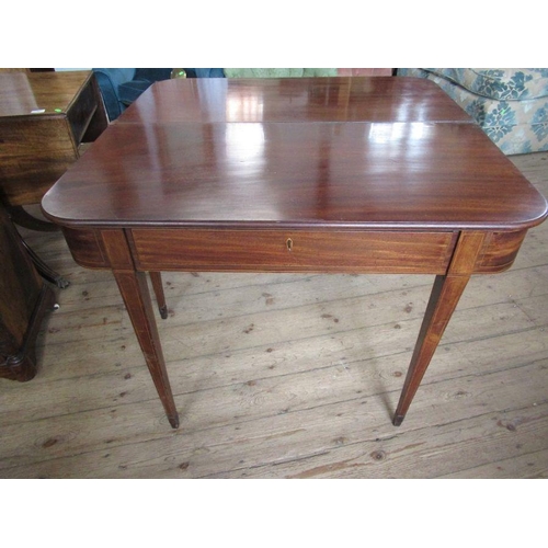 52 - A 19th century mahogany fold over table, width 39ins, height 29ins