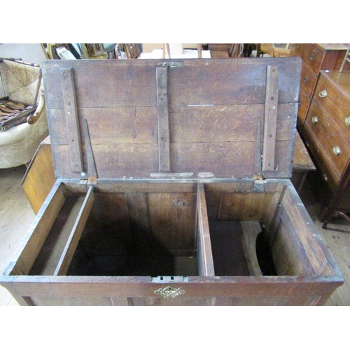 53 - An Antique oak mule chest, having rising lid over two short drawers, also having a side panel which ... 