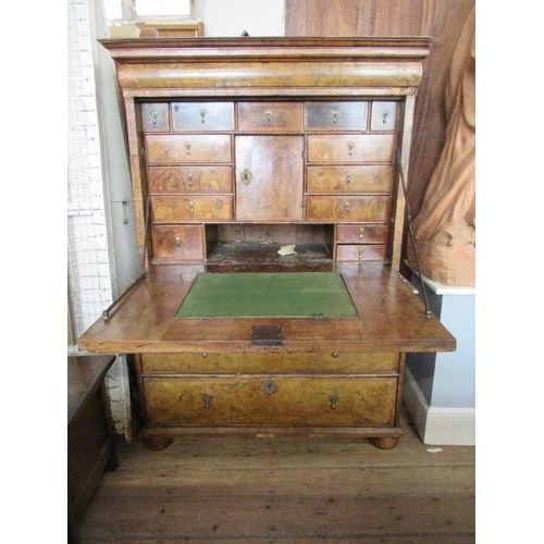 55 - An 18th century walnut secretaire cabinet, the drop down top section revealing drawers, over the bas... 