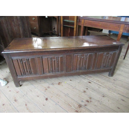 56 - An Antique oak coffer, having four carved fielded panels to the front, width 57ins, depth 17ins