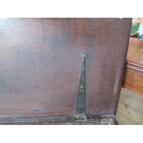 56 - An Antique oak coffer, having four carved fielded panels to the front, width 57ins, depth 17ins