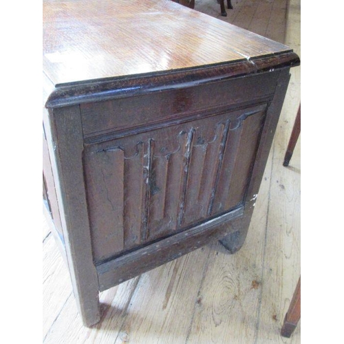 56 - An Antique oak coffer, having four carved fielded panels to the front, width 57ins, depth 17ins