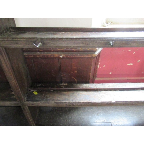 58 - A large Antique oak dresser, having a plate rack over the dresser base, fitted with four short drawe... 