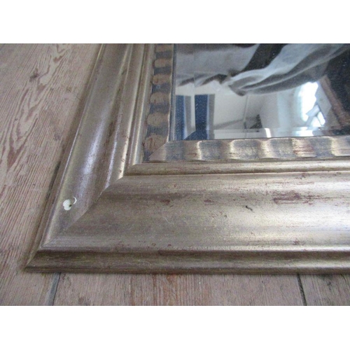 62 - A rectangular mirror within a moulded silvered frame mirror size 45.5ins x 34.5 ins