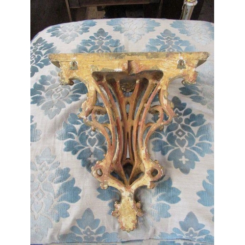 67 - A 19th century style gilt wood large wall bracket, decorated with scrolls and foliage, 60cm x 37cm