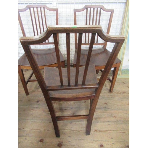 7 - Three early 19th century mahogany saddle seated chairs, with five reeded bar spindles to the back