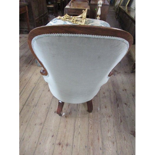 70 - A Victorian gentleman's button backed chair, with mahogany frame and sage green covers