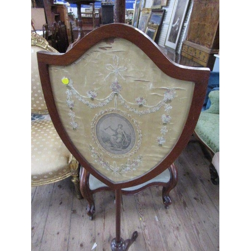 72 - A 19th century pole screen, having a shield shaped panel decorated with floral swags and a neo class... 