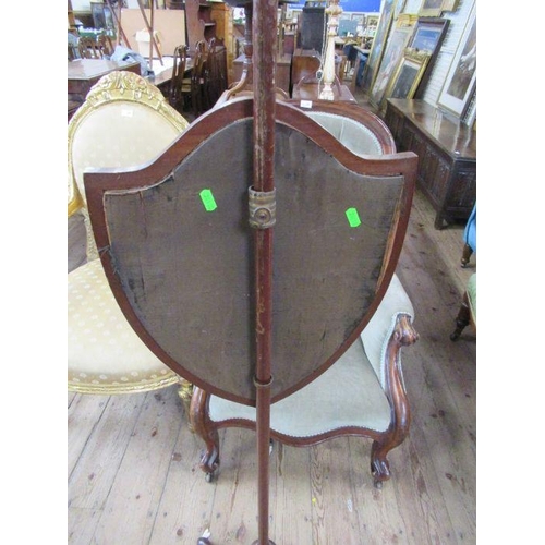 72 - A 19th century pole screen, having a shield shaped panel decorated with floral swags and a neo class... 