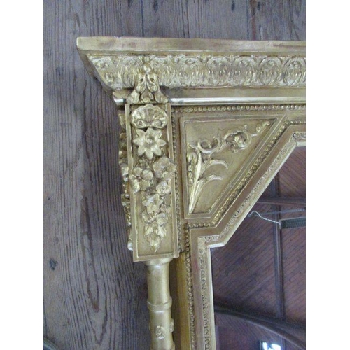 9 - A 19th century gilt framed over mantle mirror, the frame having ornate craved decoration, total widt... 