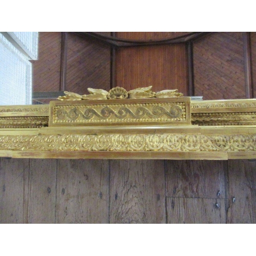 9 - A 19th century gilt framed over mantle mirror, the frame having ornate craved decoration, total widt... 