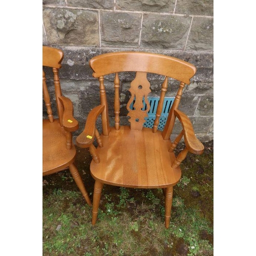 100 - A pair of pine arm chairs and an oak occasional table width 22ins , height 27ins