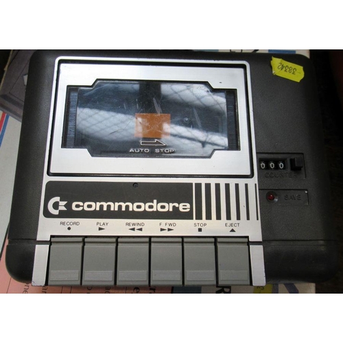 111 - A boxed Commodore plus 4, together with joystick, tape player and tapes