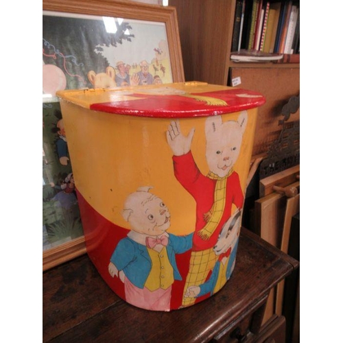 113 - A collection of Rupert Bear soft toy, models, poster, print and laundry basket