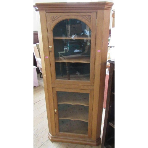 12 - A small oak double corner cupboard, height 60ins, together with a chavel mirror and a bookcase, heig... 