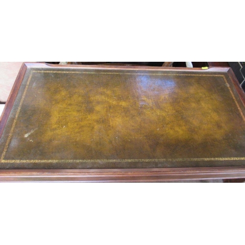 15 - A mahogany rectangular coffee table, with tooled leather top, 36ins x 19ins, height 16ins