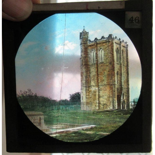 173 - A wooden four drawer filing box, containing a collection of glass magic lantern slides