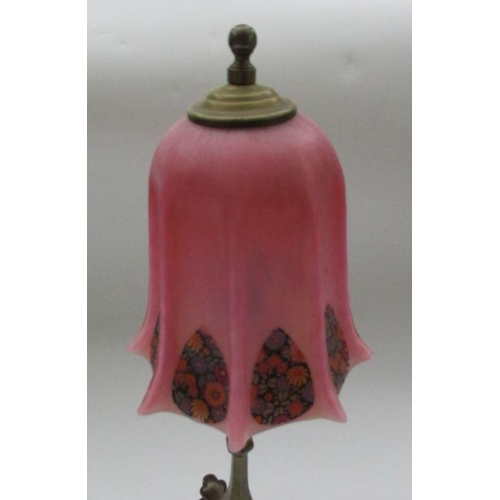 178 - A brass table lamp, in the manner of Benson, on three shaped supports in the Arts and Crafts style, ... 