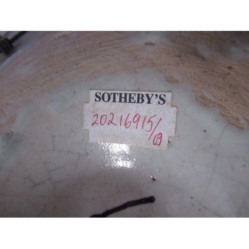 184 - An Antique tin glazed plate/charger, diameter 13ins with Sotheby's label to the base