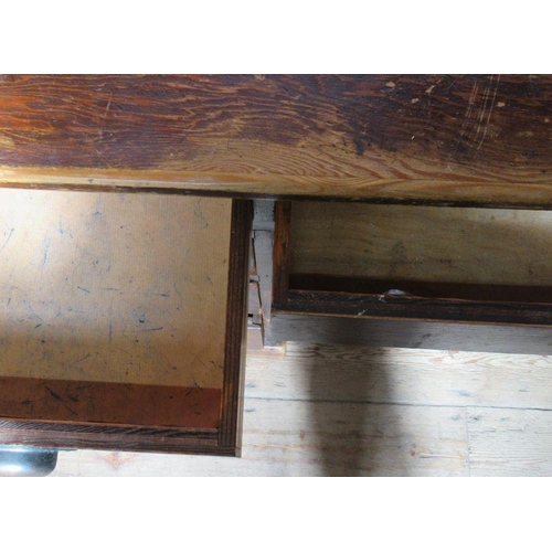 19 - An Antique stained pine desk, fitted with nine drawers around the kneehole, 53ins x 28ins, height 30... 