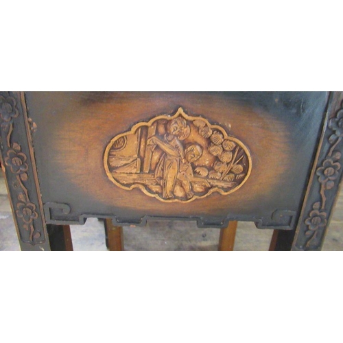 20 - A nest of four Oriental tables, with carved decoration, largest 20.75ins x 14.75ins, height 26.75ins