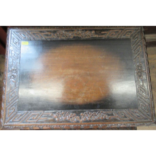 20 - A nest of four Oriental tables, with carved decoration, largest 20.75ins x 14.75ins, height 26.75ins