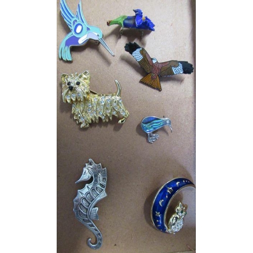 206 - A collection of costume jewellery, to include two wrist watches, brooches, necklaces etc